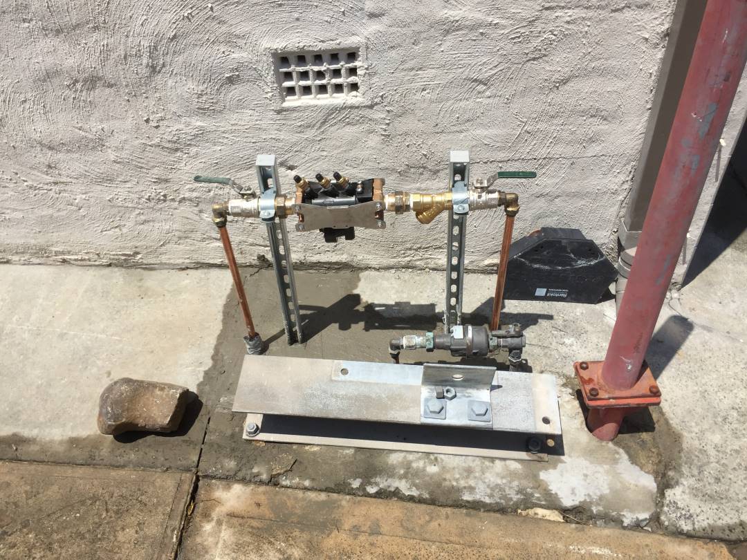 metal pipe with pipes and a metal plate